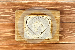 Slice of cereal toast bread with cut out heart