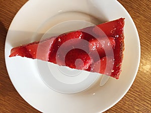Slice of cheesecake with strawberries.