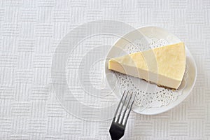 Slice cheesecake on white plate Light background Selective focus