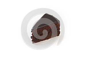 A slice of chocolate cake on a white plate.