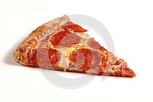 Slice of classic original Pepperoni Pizza isolated on white background