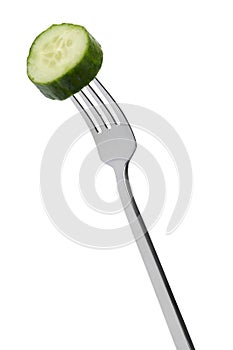 Slice of cucumber on fork