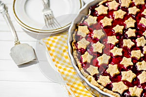 Slice of delicious homemade sour cherry pie on plate.