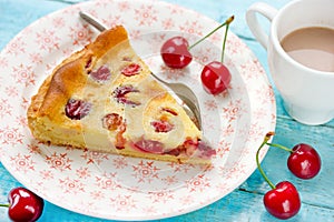 Slice of delicious pie with cherries and cream filling on plate