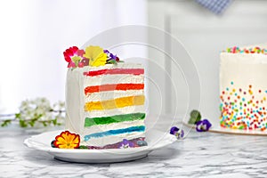 Slice of delicious rainbow cake with flowers