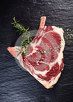 Slice of French cote de boeuf rib tips on dark background