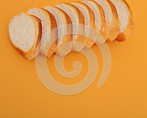 Slice of fresh bread isolated on orange background