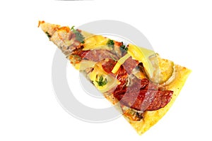 Slice of fresh homemade pizza with sausage, cheese and pickles isolated on white