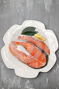 slice of fresh raw fish salmon on plate
