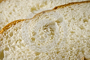 Slice of freshly baked wheat bread texture close up