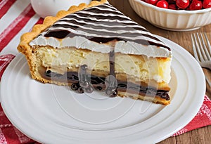 A slice of German Pie with whipped cream, biscuits, and chocolate syrup drizzled on top