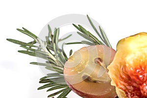 Slice of grape with twig of rosemary and fig