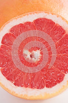 Slice of grapefruit close-up macro copy space