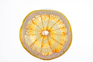 A slice of grapefruit on a white background on the lumen