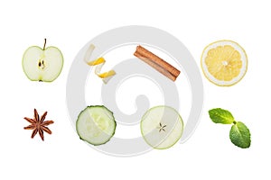 Slice of green Apple, cucumber and lemon. Lemon peel chips cinnamon and anise isolated on white