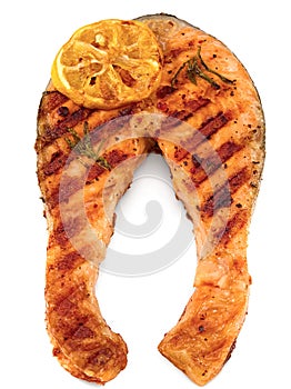 Slice of grilled fish, salmon, trout, steak with rosemary on black plate isolated on white background, clipping path