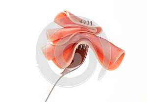 Slice of ham on fork