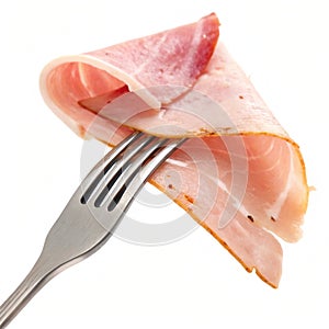 Slice of ham on a fork isolated on white