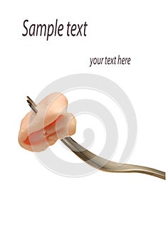 Slice of ham at fork on white