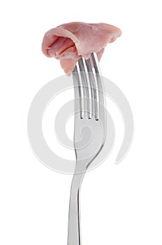 Slice of ham skewered on a fork