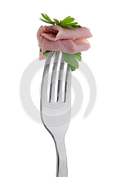 Slice of ham skewered on a fork