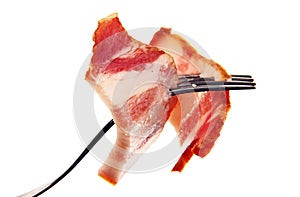 A slice of ham on a steel fork.
