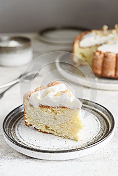 Slice of Homemade Coconut Buttermilk Pound Cake glazed whipped cream