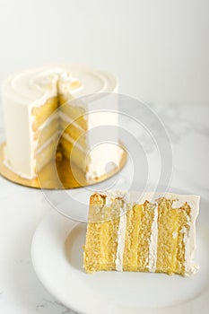 Slice of lemon cake on marble table