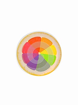 A slice of lemon in a multi-color spectrum, a lemon painted in the colors of the itten circle