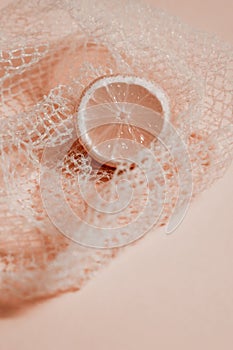 Cross section lemon pink slice background close-up net netting packing package photo