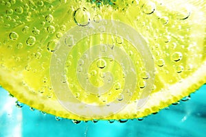 Slice of lemon in sparkling water