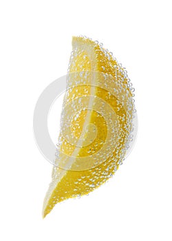 Slice of lemon in sparkling water on white background. Citrus soda