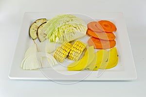 Slice Mixed vegetables on white dish isolate