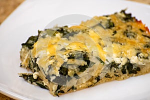 Slice of Ossetian pie with cheese and herbs