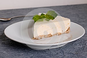 Slice of Plain New York Cheesecake on white plate