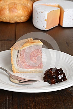Slice of pork pie with fork