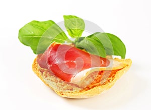 Slice of prosciutto on crispy bread