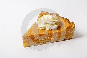 Slice of pumpkin pie on a plate. Selective focus.