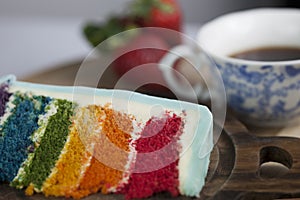 A Slice of Rainbow Cake with a Cup of Coffee