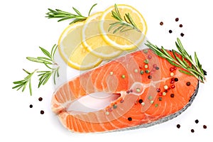 Slice of red fish salmon with lemon, rosemary and peppercorns isolated on white background. Top view. Flat lay