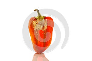 Slice of red sweet pepper on white isolated background