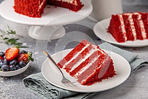 Slice of Red Velvet cake on white plate