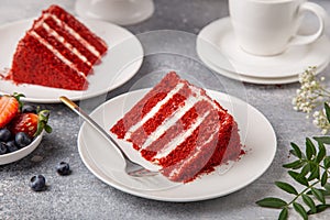 Slice of Red Velvet cake on white plate