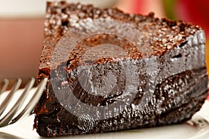 Slice of rich dark chocolate cake