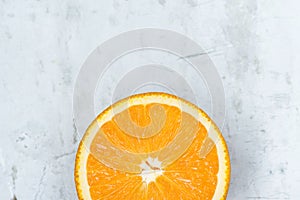 Slice of Ripe Juicy Vibrant Vivid Color Orange on Gray Stone Concrete Metal Background. High Resolution Food Poster. Vitamins