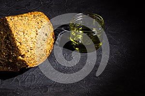 slice of rustic natural yeast-free bread with flax, poppy seeds, sesame seeds, millet, pumpkin and sunflower seeds, with