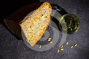 slice of rustic natural yeast-free bread with flax, poppy seeds, sesame seeds, millet, pumpkin and sunflower seeds, with