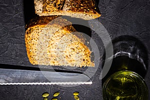 slice of rustic natural yeast-free bread with flax, poppy seeds, sesame seeds, millet, pumpkin and sunflower seeds, with