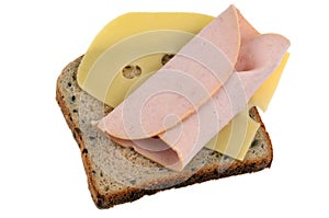 Slice of sandwich bread with ham and Emmental cheese close-up on white background