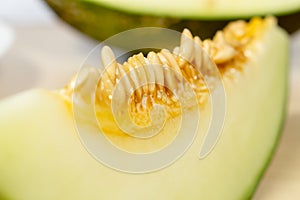 Slice of Santa Claus melon with seeds